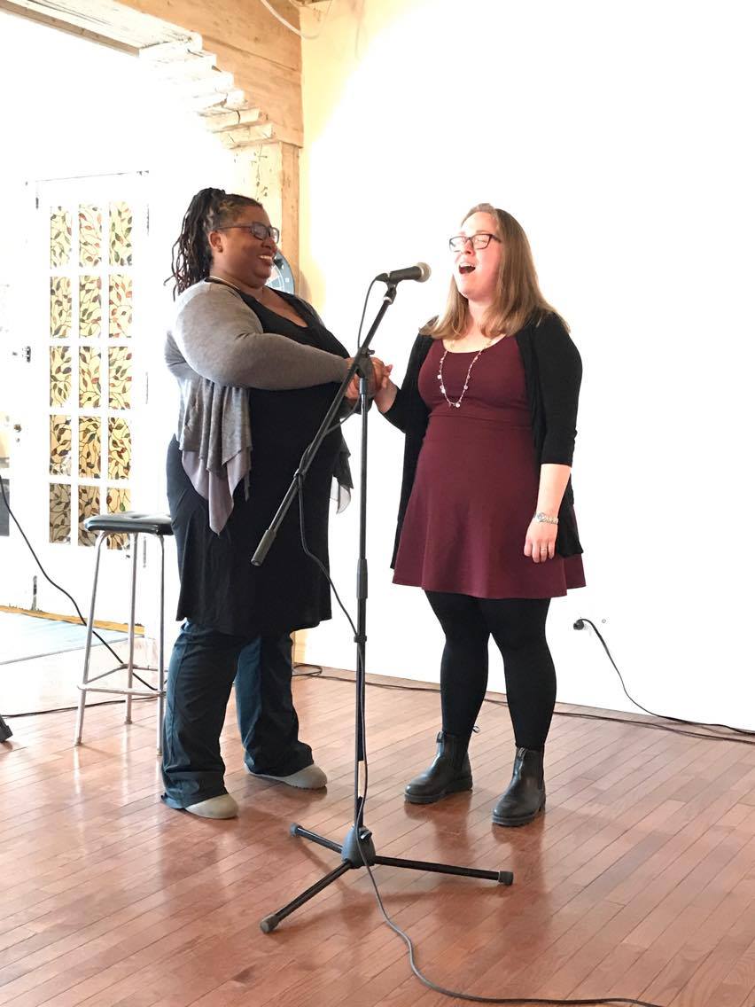 Carolyn Thompson coaching with a microphone